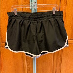 Black Women's Athletic Works Shorts with White Stripe on Back.